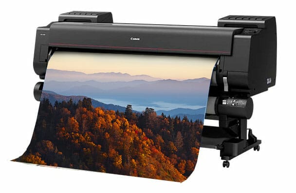 wide format printer printing a photograph of a foggy mountain range in autumn
