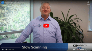 man standing in front of wide format scanner